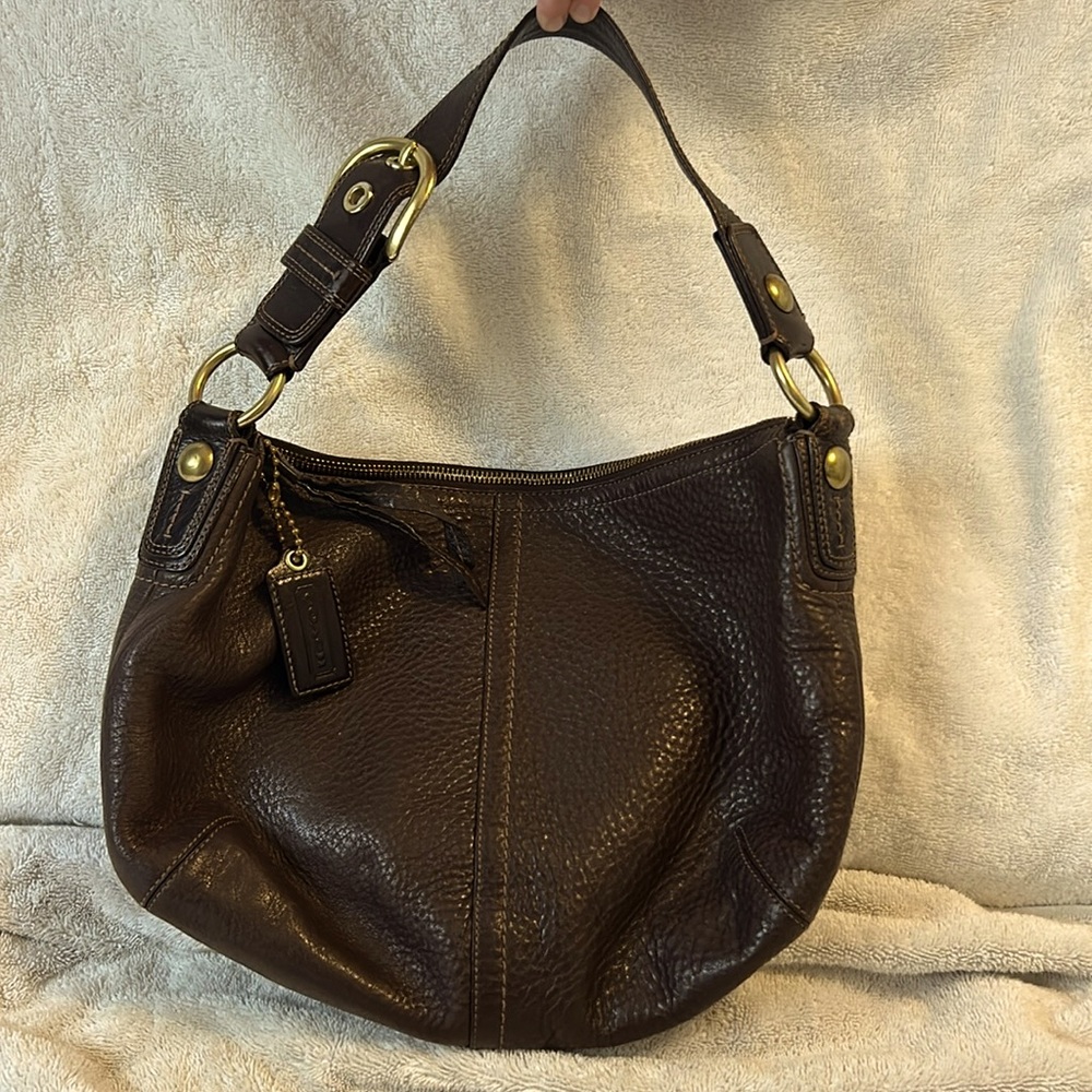 Brown leather coach purse with shoulder strap